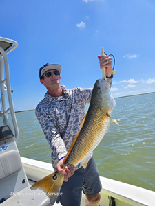 A person fishing at Point Comfort