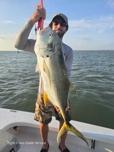 Angler with a big fish in Point Comfort