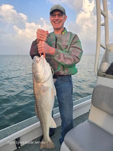 Large redfish caught on fishing charter boat in Point Comfort TX waters