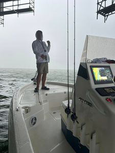 Fishing boat navigation electronics display screen showing GPS chart and sonar equipment on deck in Port Arthur TX waters
