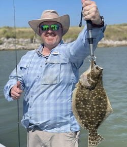 Angler with a fishing rod standing in Matagorda
