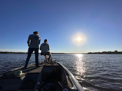 Picturesque view of O.H. Ivie Lake with fishing activity