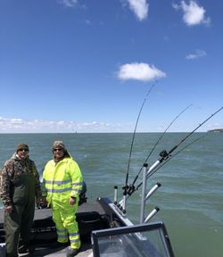 Two people fishing at a lakeside in Marblehead