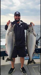 Two coho and chinook salmon fishing in Ontario