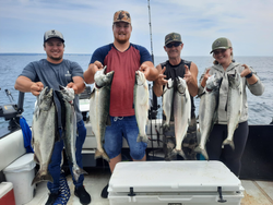 Seven chinook salmon, coho salmon, and rainbow trout caught on a fishing trip in Ontario