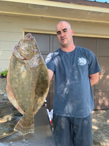 A lone fisherman in Florida reeling in a catch