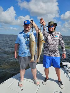 Two people fishing in TX