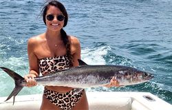 Angler holding a 26-inch fish in Gulf Shores