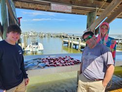 Three people fishing in Gulf Shores