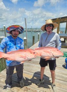 Two people fishing in Gulf Shores