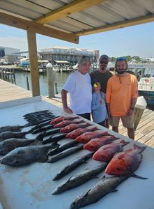 Three people fishing at Gulf Shores