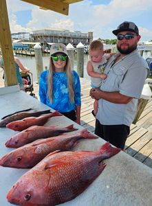 3 people fishing together in Gulf Shores