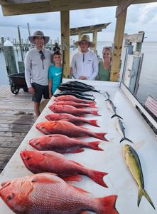 4 people fishing at Gulf Shores