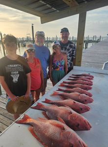 4 people fishing in Alabama with 2 fish