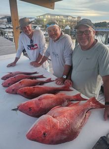 Three people fishing at Gulf Shores