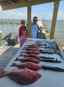4 people fishing at the Gulf Shores location