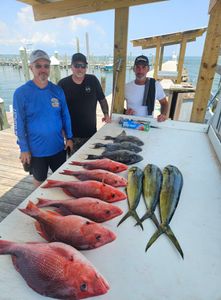 Three people fishing in the Gulf Shores location