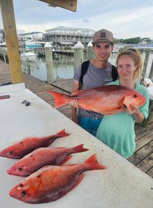 Two people fishing in the Gulf Shores area