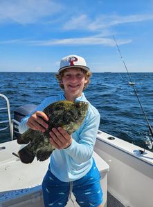 Lone angler fishing in the waters of Gulf Shores