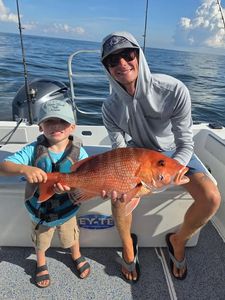Red snapper fishing catch displayed on boat deck in Orange Beach AL