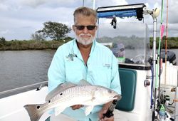 An angler caught a 18-inch redfish in Texas City