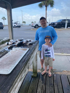 Two people fishing in Pass Christian