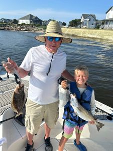 Two spotted weakfish, 11 inches long, caught while fishing at Oak Island