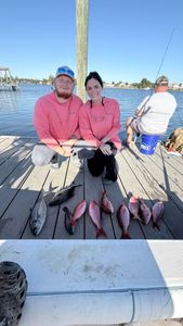 Two people enjoying fishing tours in FL