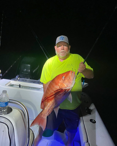 Fisherman holding a 19-inch fish in Florida