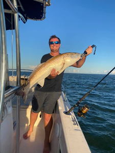 A person fishing with a rod in Florida