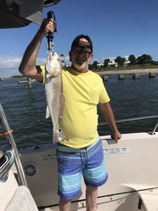 Angler fishing in Florida with a big 21-inch catch