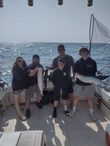 5 people fishing in Kenosha with 2 big fish