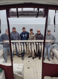 A group of 6 people fishing on a lake in Kenosha