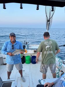 Two people fishing in Kenosha