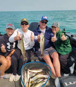 4 people fishing with 2 fish in Detroit