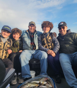 5 people fishing in Detroit
