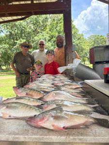 5 fishermen enjoying their catch in MS