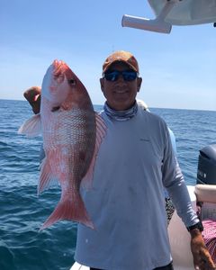 One angler reeling in a big fish at North Myrtle Beach