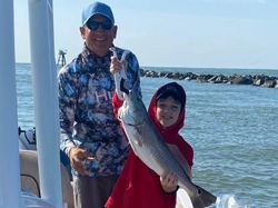 Fisherman holding a large redfish in South Carolina