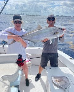 Two anglers fishing in Florida with a small catch