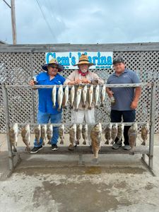 Fishing catch display showing Black Drum and Speckled Trout from Corpus Christi TX at marina cleaning station
