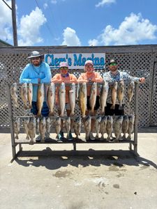 Successful fishing trip displaying redfish and black drum catch at Clem's Marina in Corpus Christi TX