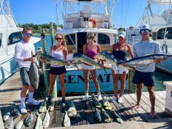 Successful fishing charter in Morehead City NC displaying mahi mahi, yellowtail, and wahoo catch on dock
