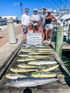 Fresh caught wahoo and mahi mahi displayed on dock in Morehead City NC after successful sportfishing charter