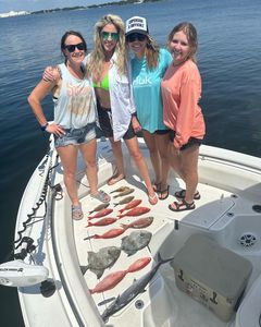Four people fishing at Panama City Beach