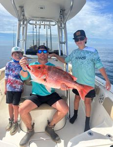 A group of 3 people fishing in Panama City Beach