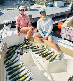 Two people fishing on the beach in Panama City Beach