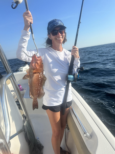 Reeling in a Red Grouper on a clear day in Panama City Beach!