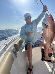 Snagged a vibrant Red Snapper in the crystal-clear waters of Panama City Beach!