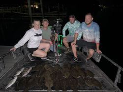 Four people enjoying a fishing and hunting trip in Panacea